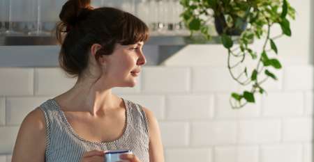 Woman drinking coffee thinking