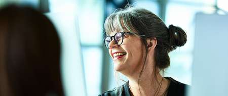 Woman happy at work wears red lipstick